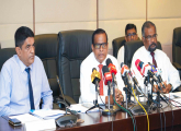 By addressing the press conference at minstry of Finance